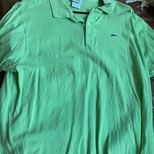 It’s a Lacoste green shirt size 7